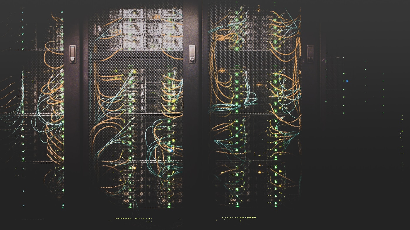 Illuminated data center server racks with fiber and network cabling