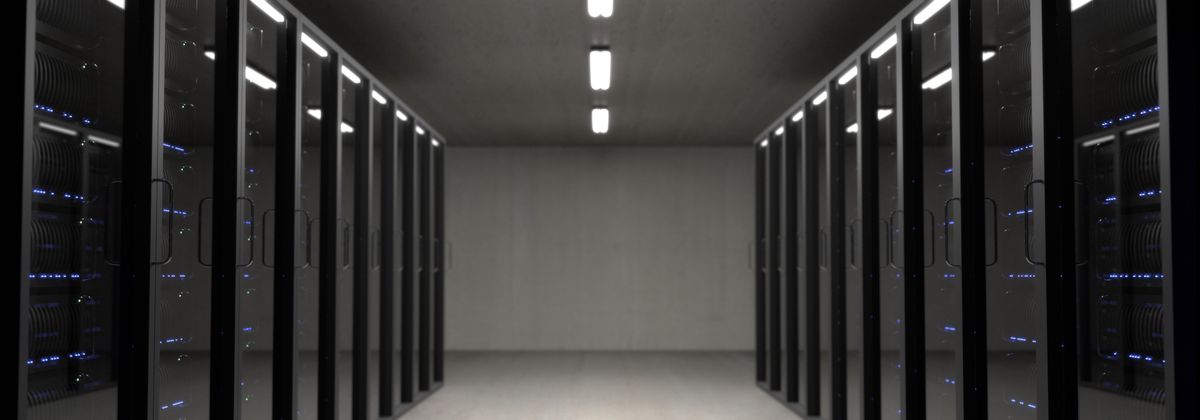 Clean data center aisle between rows of server cabinets